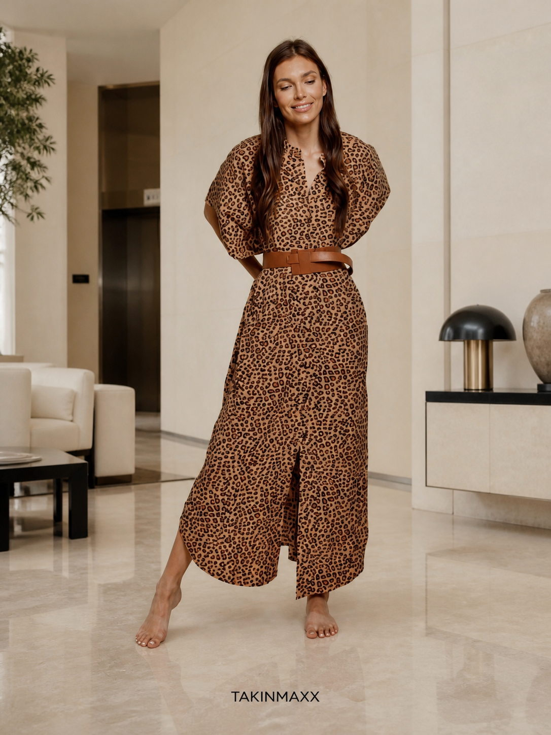 TAKINMAXX cheetah button-down maxi dress in hotel lobby