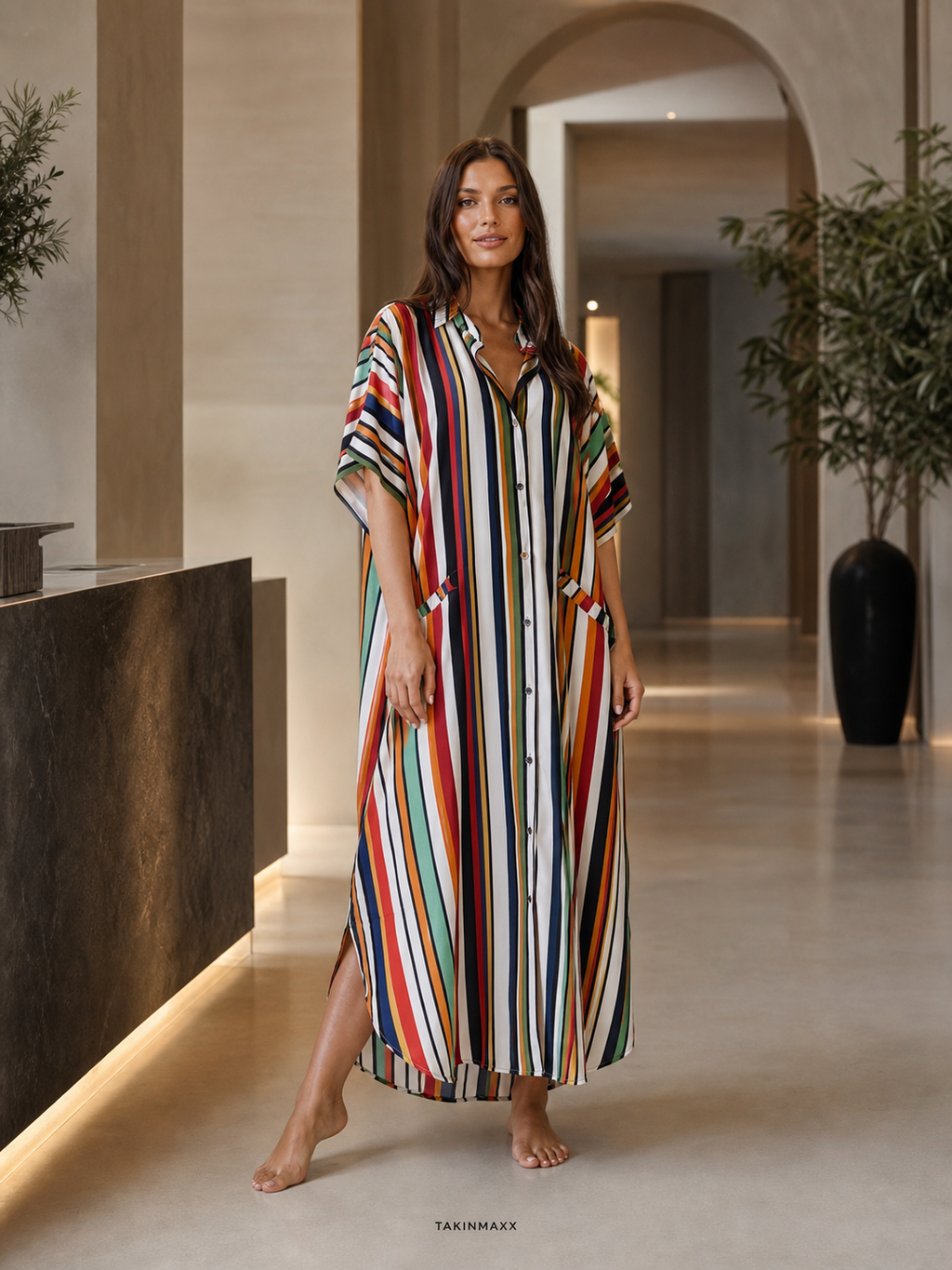 TAKINMAXX colorful striped button-down maxi dress in hotel lobby